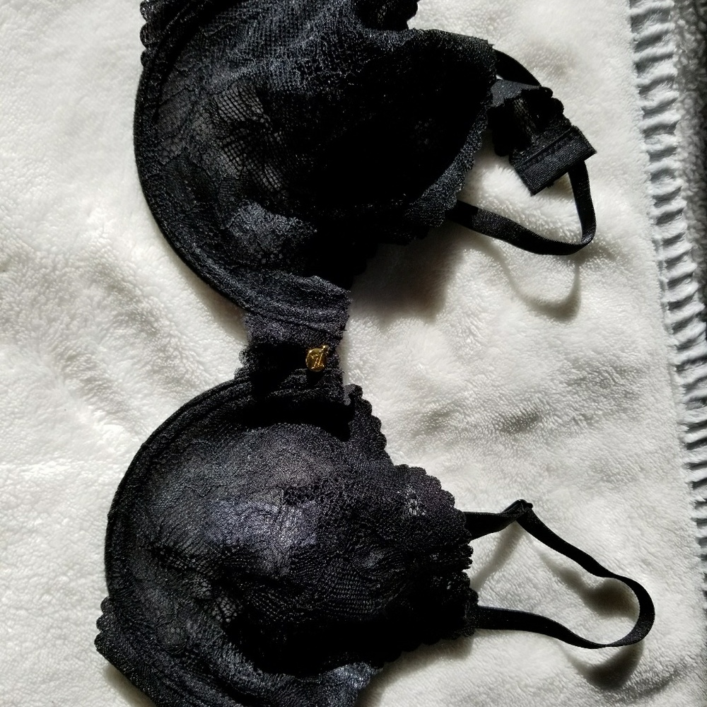 Black lace bra with scalloped edge.